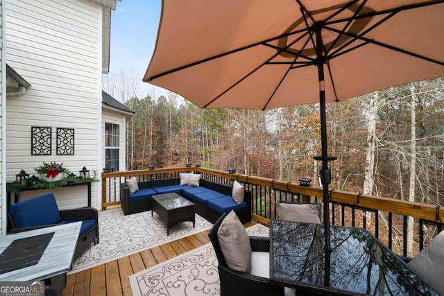 wooden terrace with outdoor lounge area