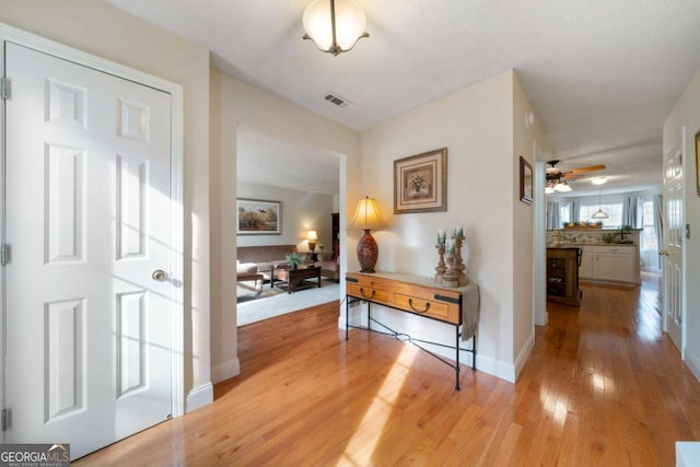 corridor featuring light hardwood / wood-style flooring