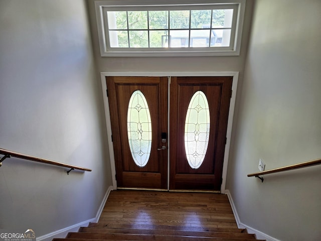 foyer with dark hardwood / wood-style flooring