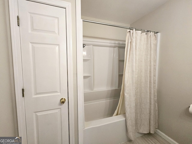 bathroom featuring shower / bath combination with curtain