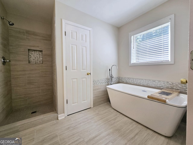 bathroom featuring plus walk in shower