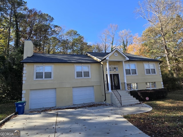 bi-level home featuring a garage