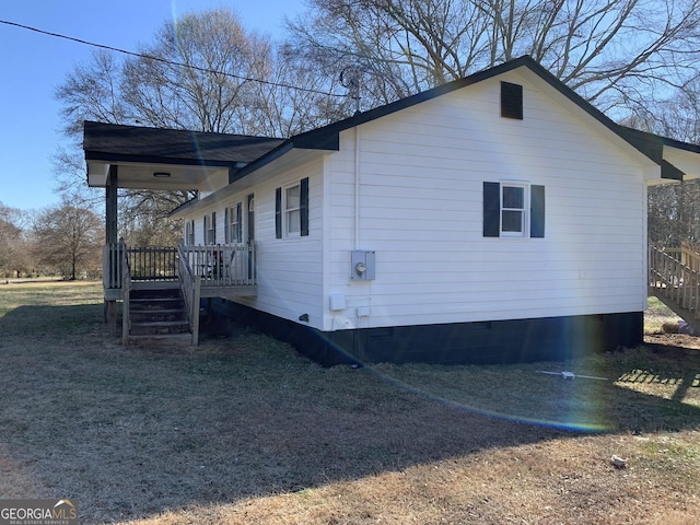 view of property exterior with a wooden deck