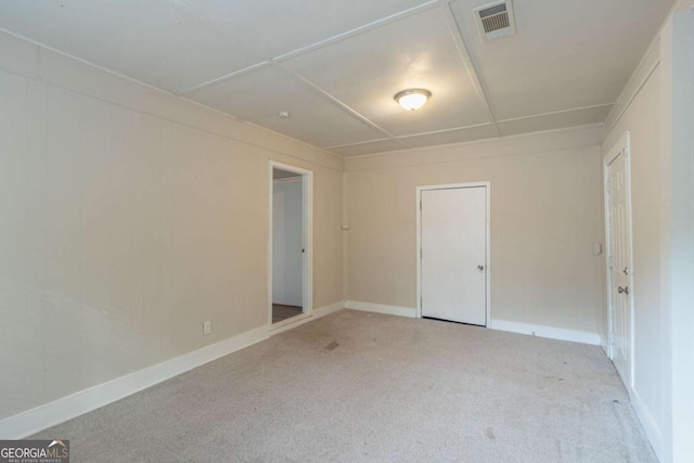 spare room with light colored carpet