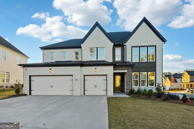 view of front of property featuring a front yard and a garage