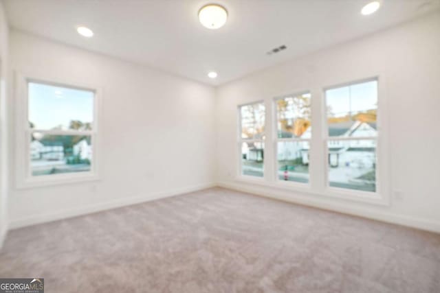 unfurnished room featuring carpet floors