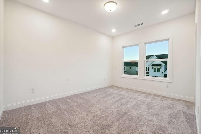 empty room with carpet flooring