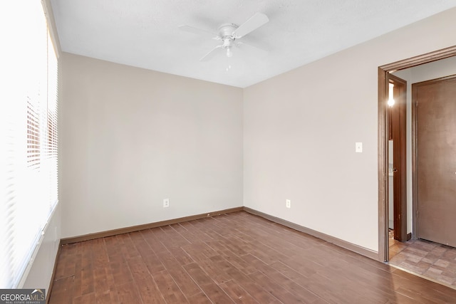 unfurnished room featuring ceiling fan and hardwood / wood-style flooring