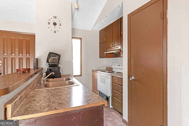 kitchen featuring a textured ceiling, white electric range oven, sink, and tasteful backsplash