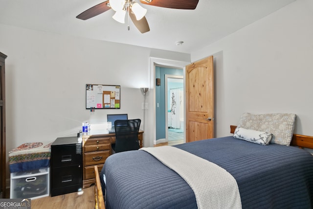 131 Logan Cir, Ellijay, GA 30540 - bedroom featuring light wood-style flooring, a desk, and a ceiling fan