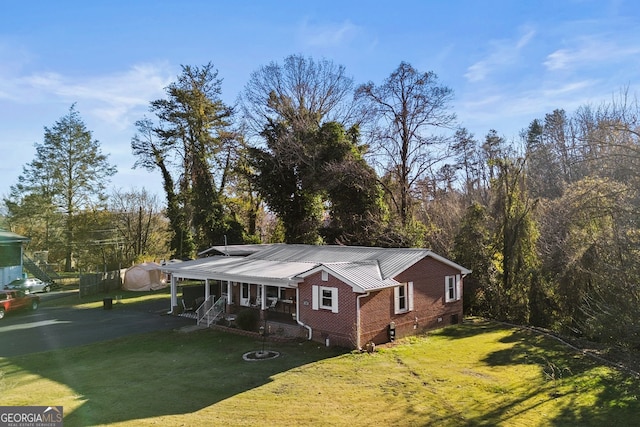 131 Logan Cir, Ellijay, GA 30540 - view of front facade featuring brick siding, a front lawn, covered porch, and a metal roof