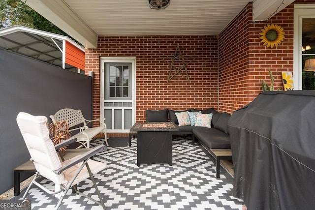 view of patio / terrace with an outdoor living space and area for grilling