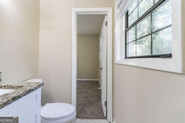 bathroom with vanity and toilet