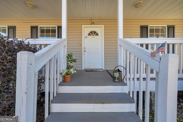 property entrance with covered porch