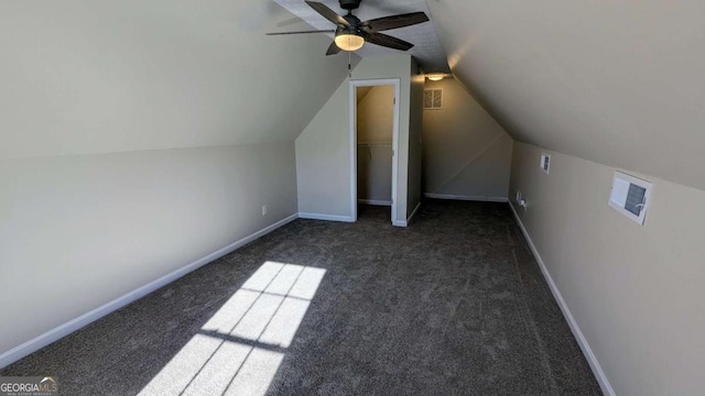 bonus room with ceiling fan, lofted ceiling, and dark colored carpet