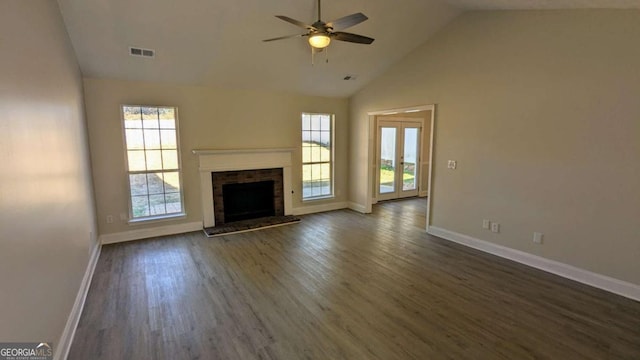 unfurnished living room featuring ceiling fan, a fireplace, high vaulted ceiling, and dark wood-type flooring