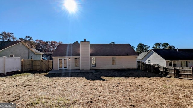 rear view of house featuring french doors and a patio