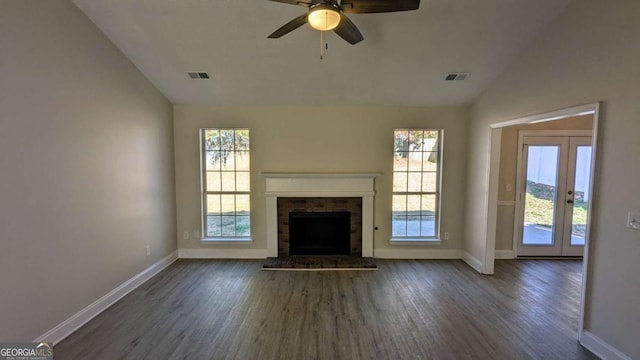 unfurnished living room with dark hardwood / wood-style floors, a healthy amount of sunlight, and lofted ceiling