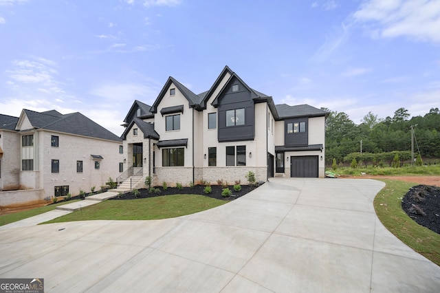 view of front of house featuring a front yard and a garage