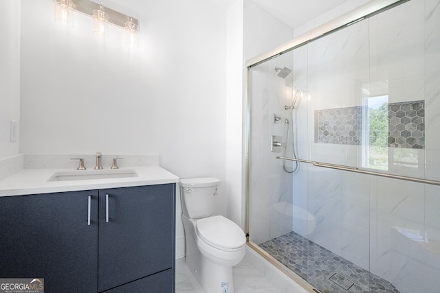 bathroom with vanity, toilet, and an enclosed shower