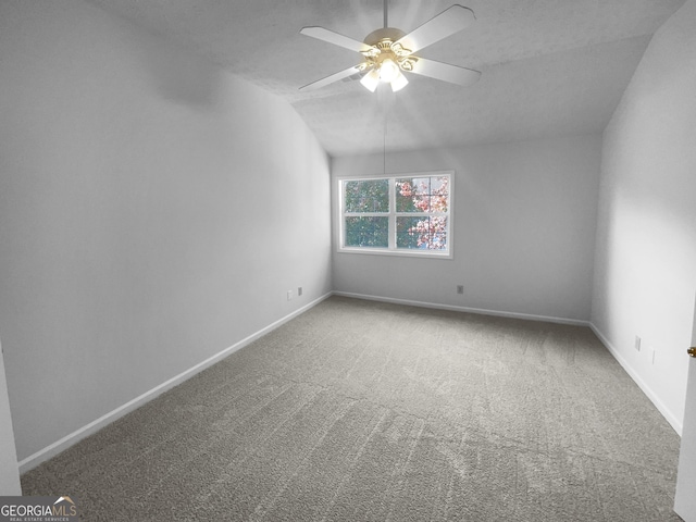 4279 Orchard Grv, Stone Mountain, GA 30083 - carpeted spare room featuring ceiling fan and vaulted ceiling