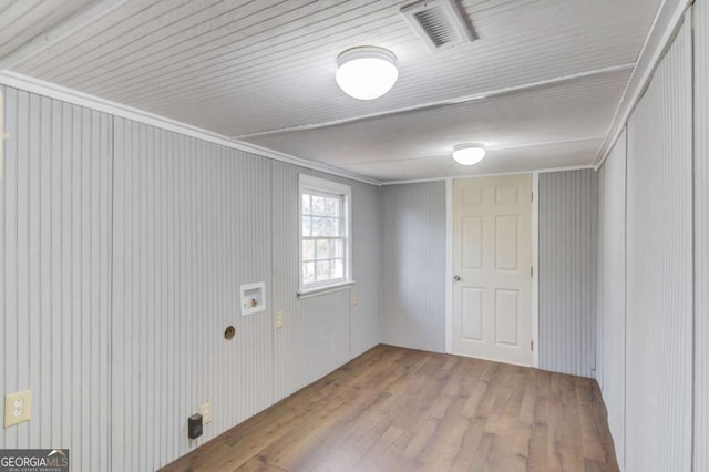 kitchen with light hardwood / wood-style flooring, ornamental molding, and sink