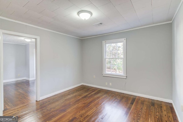 interior space with hardwood / wood-style flooring, crown molding, and hookup for a washing machine