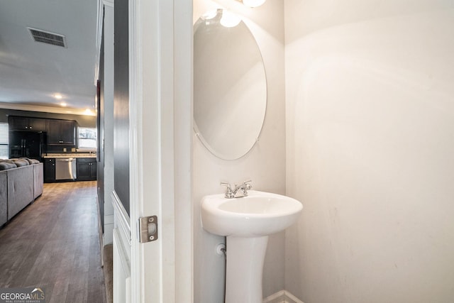 bathroom with wood-type flooring