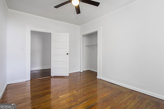 unfurnished bedroom with ceiling fan, dark wood-type flooring, and a textured ceiling