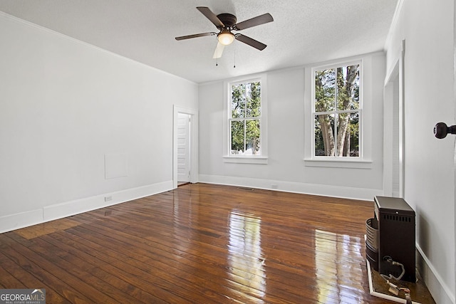 unfurnished room with hardwood / wood-style floors, ceiling fan, crown molding, and a textured ceiling