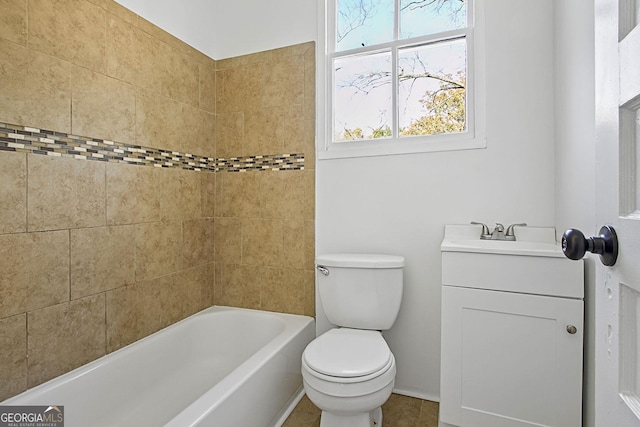 full bathroom with tile patterned floors, vanity, toilet, and tiled shower / bath