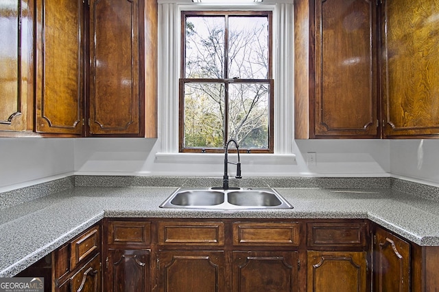 kitchen with sink and dark brown cabinets