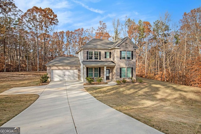 view of front of house featuring a front yard and a garage