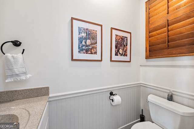 bathroom with vanity and toilet