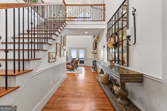 foyer entrance featuring french doors and light wood-type flooring