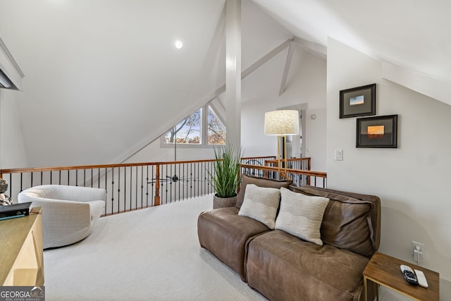 carpeted living room featuring high vaulted ceiling