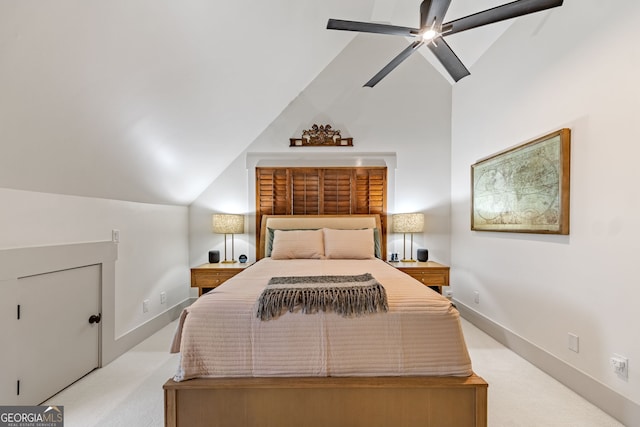 bedroom featuring ceiling fan, light colored carpet, and vaulted ceiling