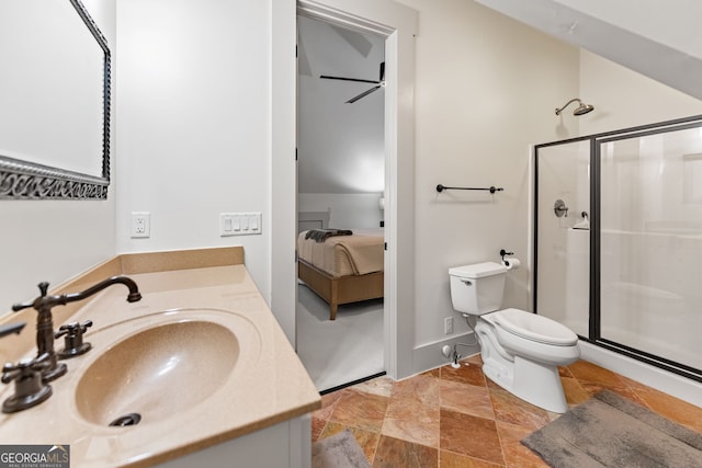 bathroom with vanity, ceiling fan, toilet, and a shower with door