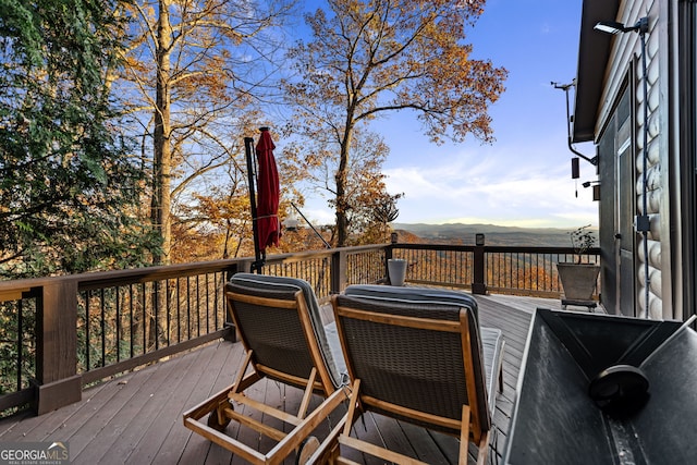 wooden deck featuring a mountain view