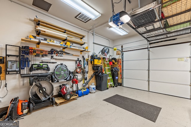 garage featuring a workshop area and a garage door opener