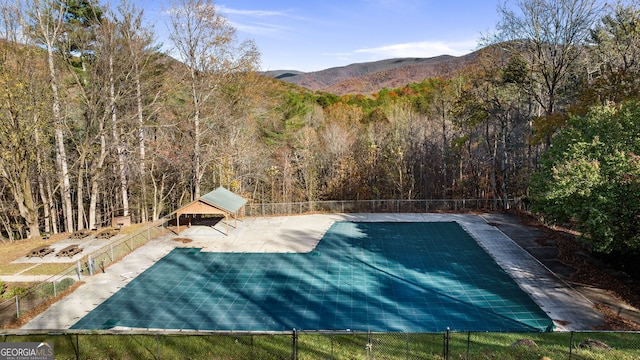 view of swimming pool featuring a mountain view