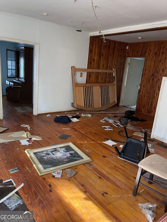 miscellaneous room featuring hardwood / wood-style flooring and wood walls