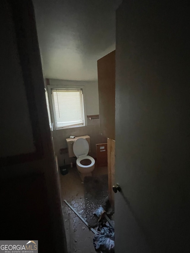 bathroom featuring tile patterned floors and toilet