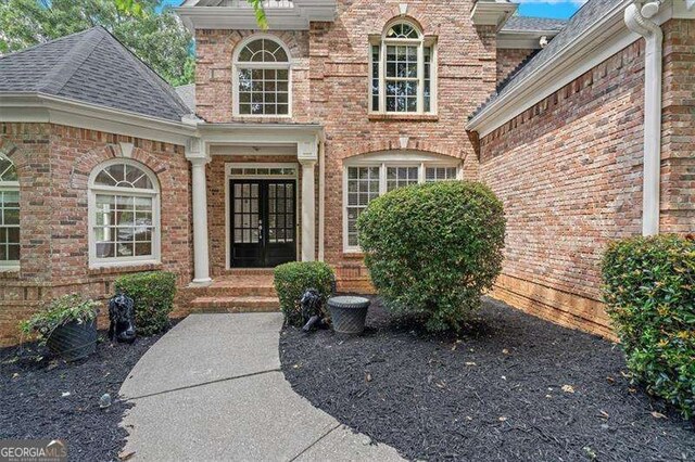 entrance to property featuring french doors