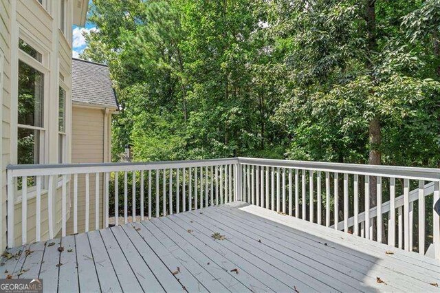 wooden terrace with area for grilling