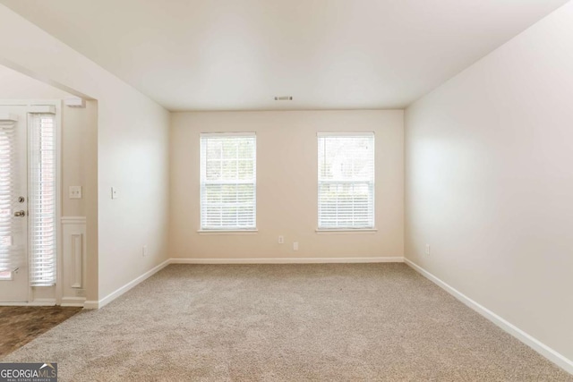 spare room with carpet floors