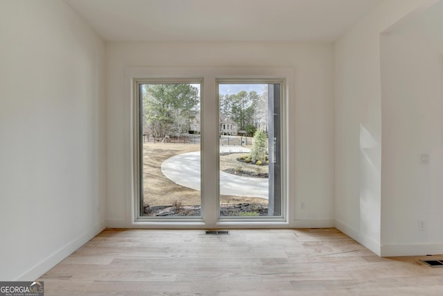 doorway to outside with light hardwood / wood-style flooring