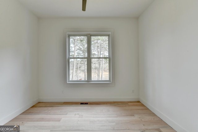 unfurnished room featuring ceiling fan and light hardwood / wood-style flooring