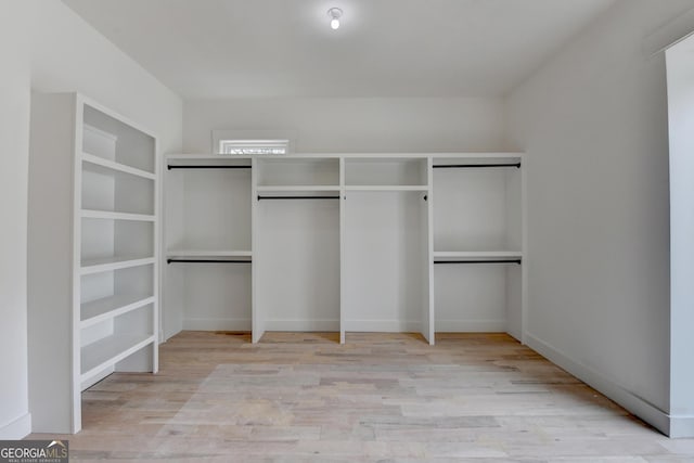 walk in closet featuring light hardwood / wood-style floors