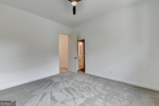 unfurnished bedroom with light carpet and ceiling fan